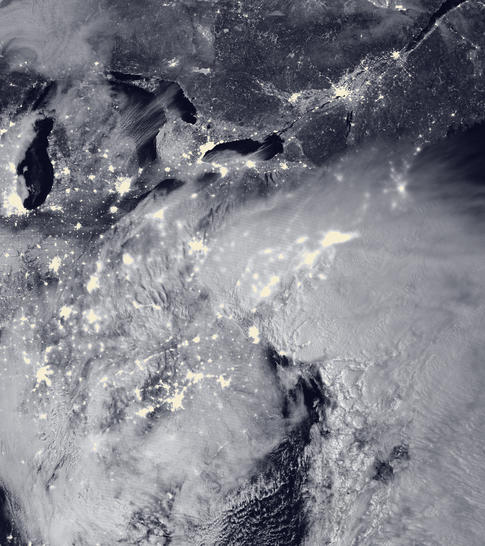 NASA satellite sees beauty in a moonlit blizzard